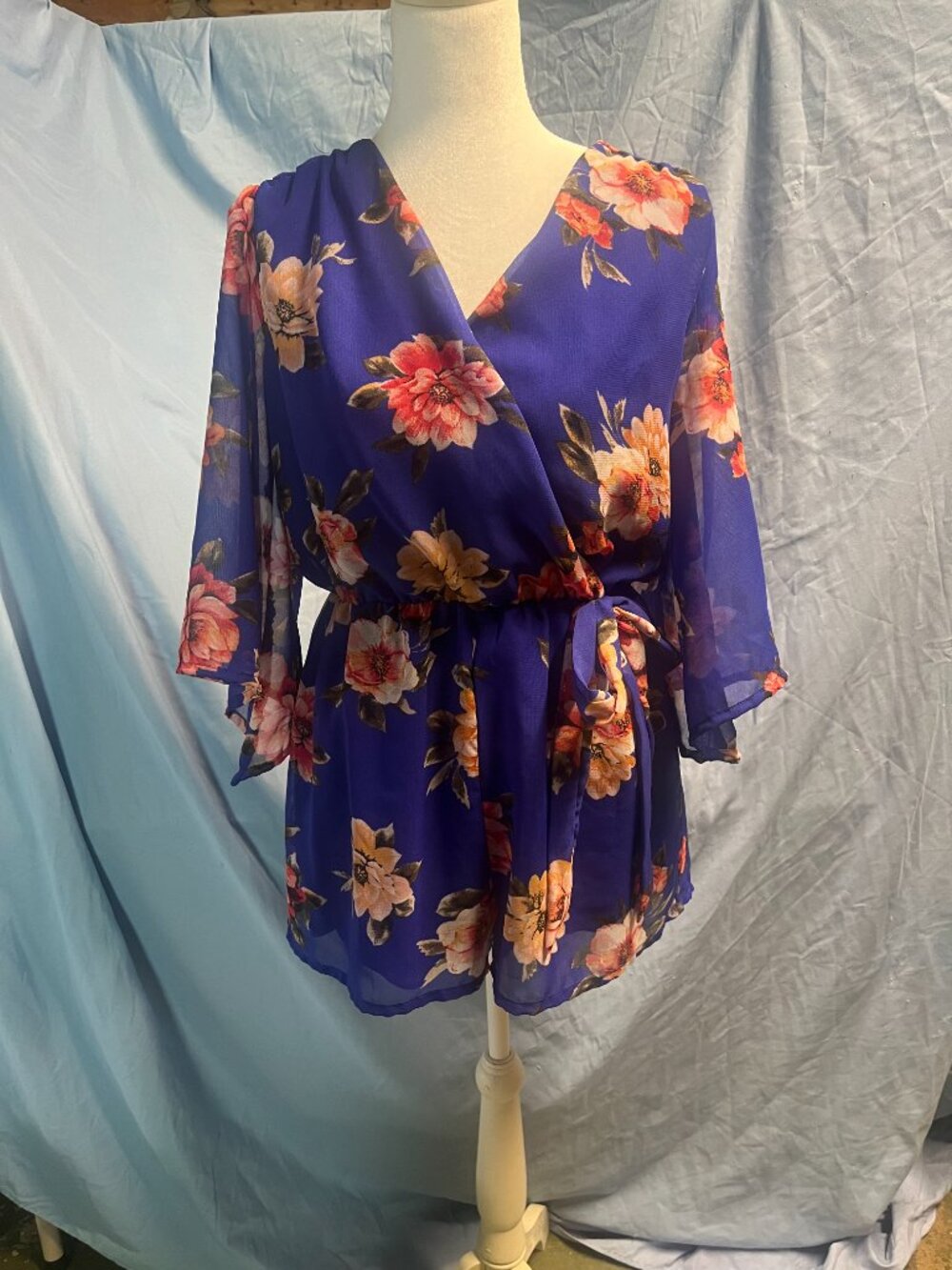 Baily Blue Small one‑piece romper Baily Blue floral wrap romper,